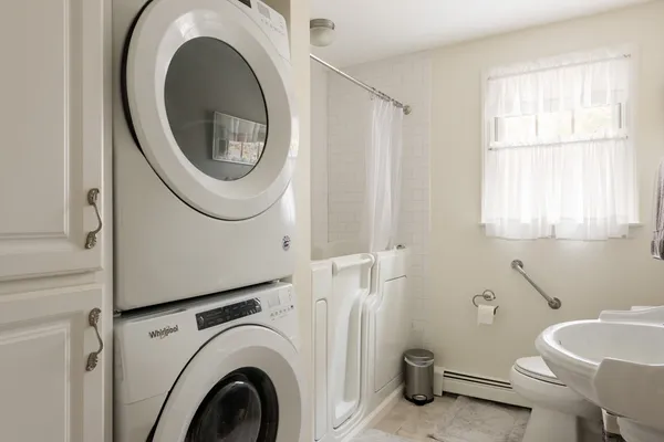 a bathroom with a toilet a sink and a mirror