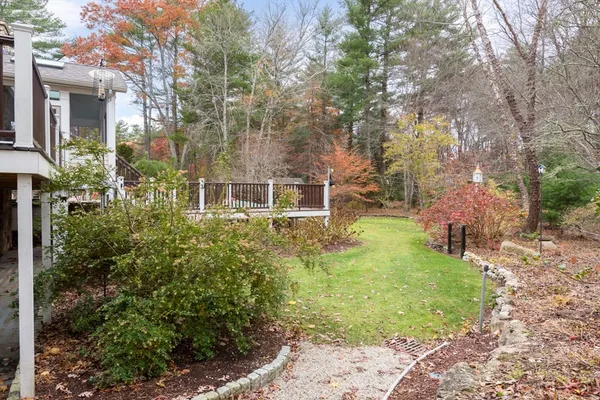 a backyard of a house with outdoor seating