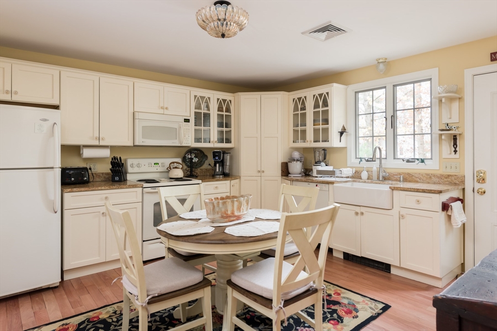 15 Parlowtown Road, Unit A Marion, MA 02738 - Photo 8 of 16 a kitchen with stainless steel appliances kitchen island granite countertop a sink and cabinets