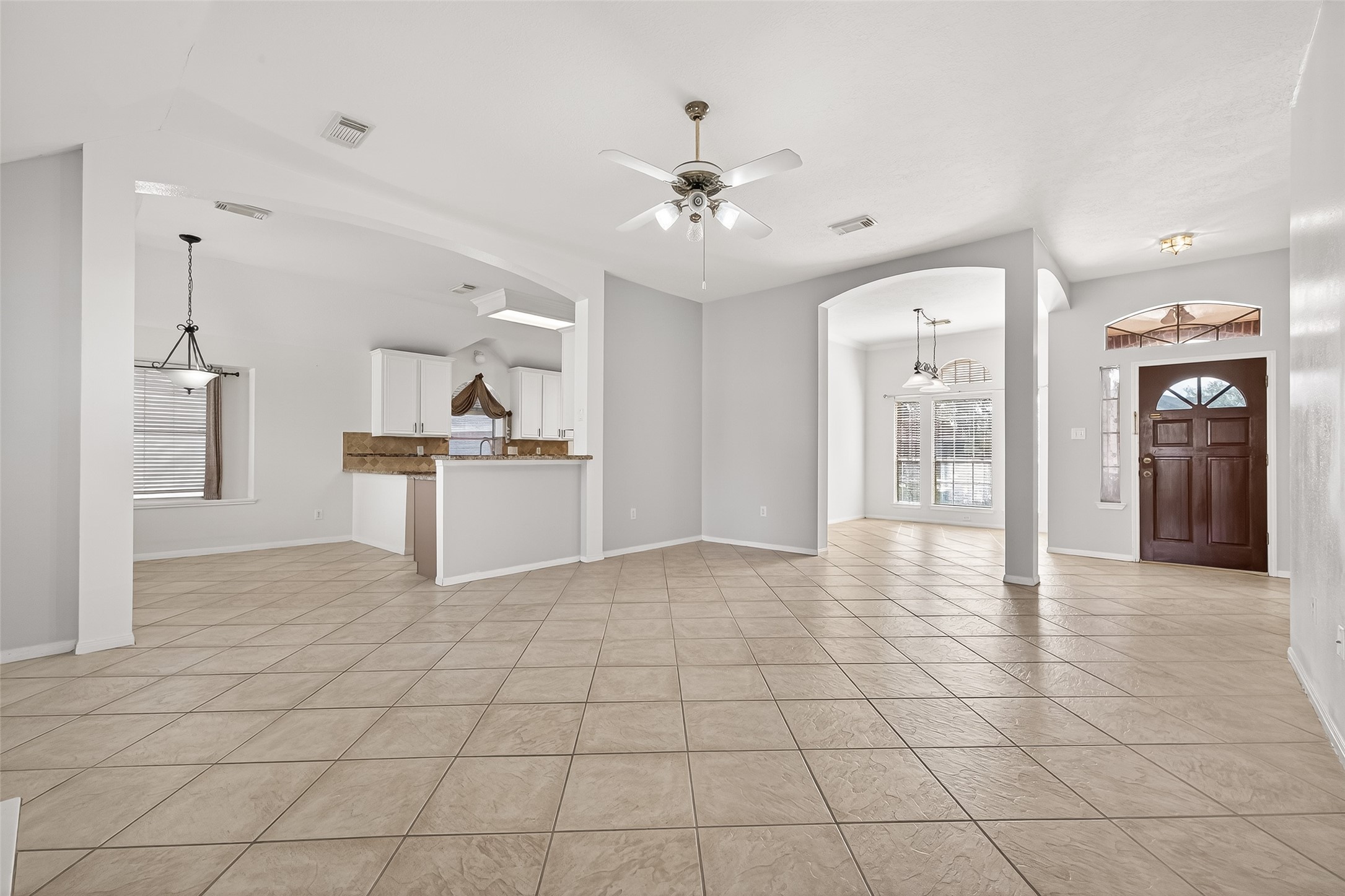 20839 Rivershire Lane Houston, TX 77073 - Photo 11 of 50 a view of a kitchen with a sink and a refrigerator