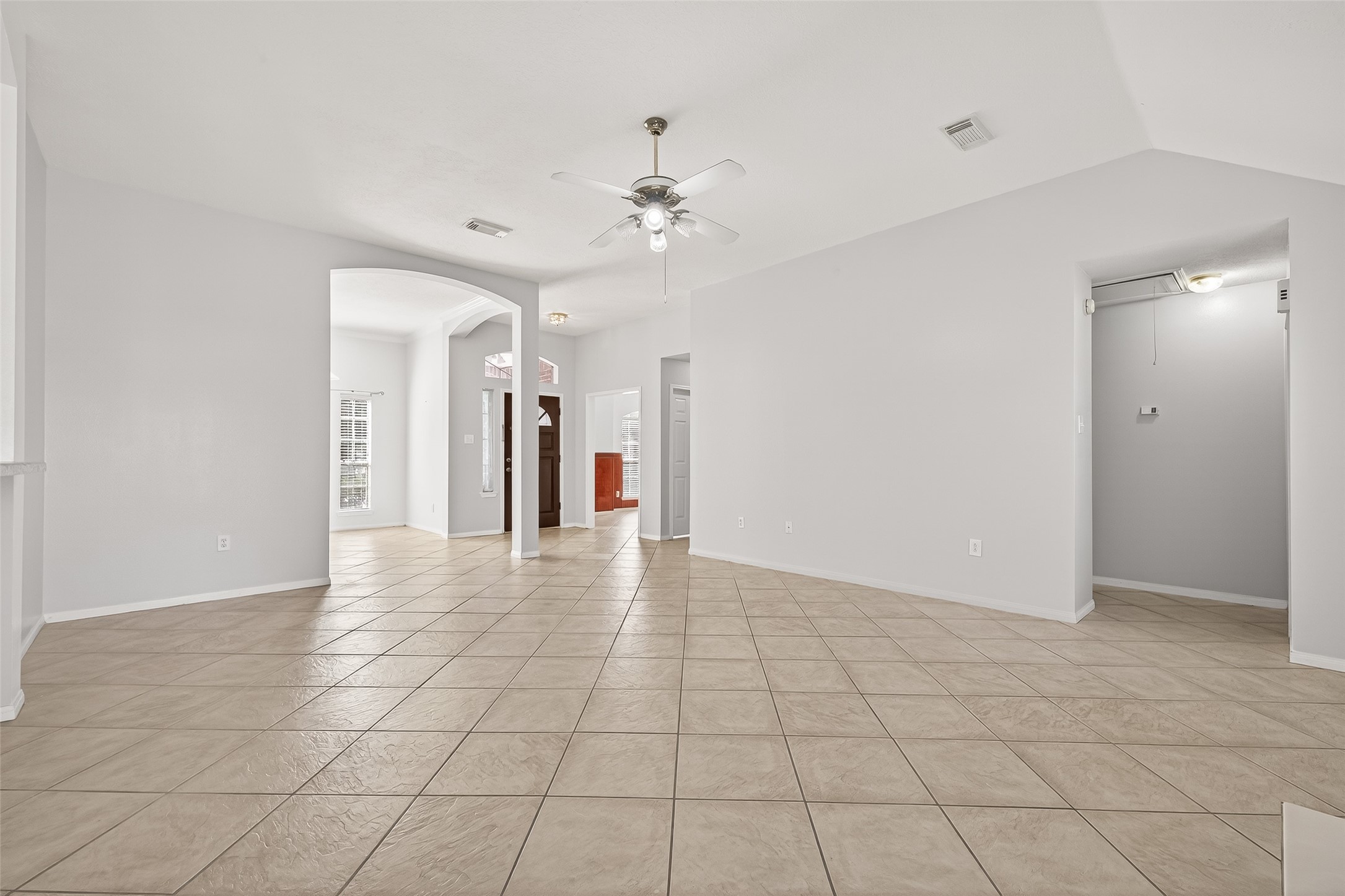 20839 Rivershire Lane Houston, TX 77073 - Photo 12 of 50 a view of an empty room with a ceiling fan