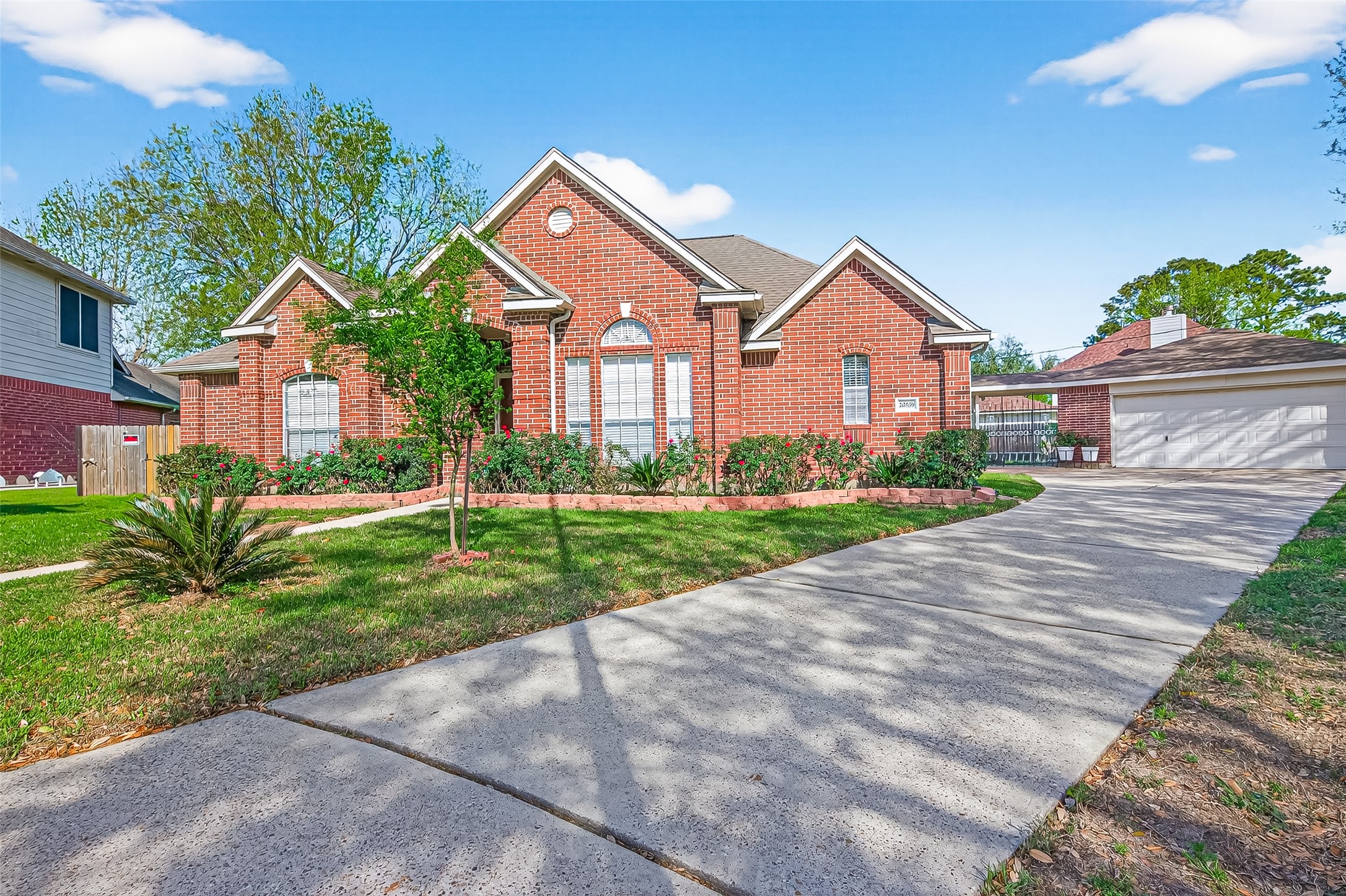 20839 Rivershire Lane Houston, TX 77073 - Photo 2 of 50 a front view of a house with a yard and potted plants