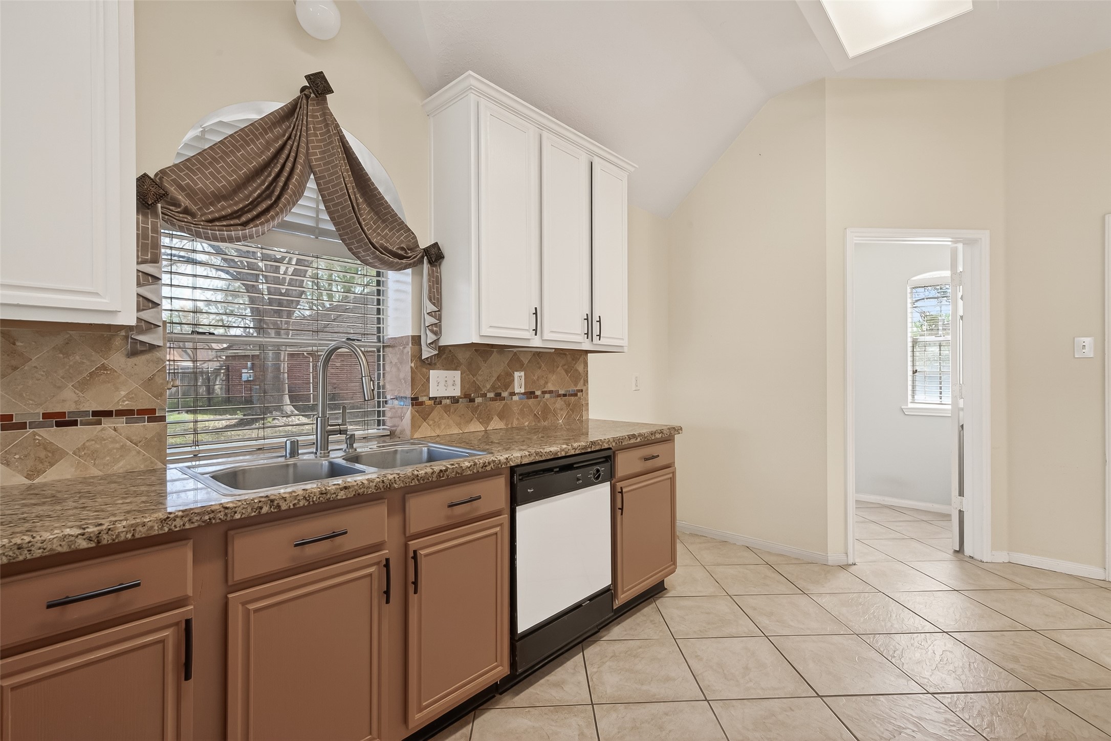 20839 Rivershire Lane Houston, TX 77073 - Photo 22 of 50 a kitchen with granite countertop a sink and a stove