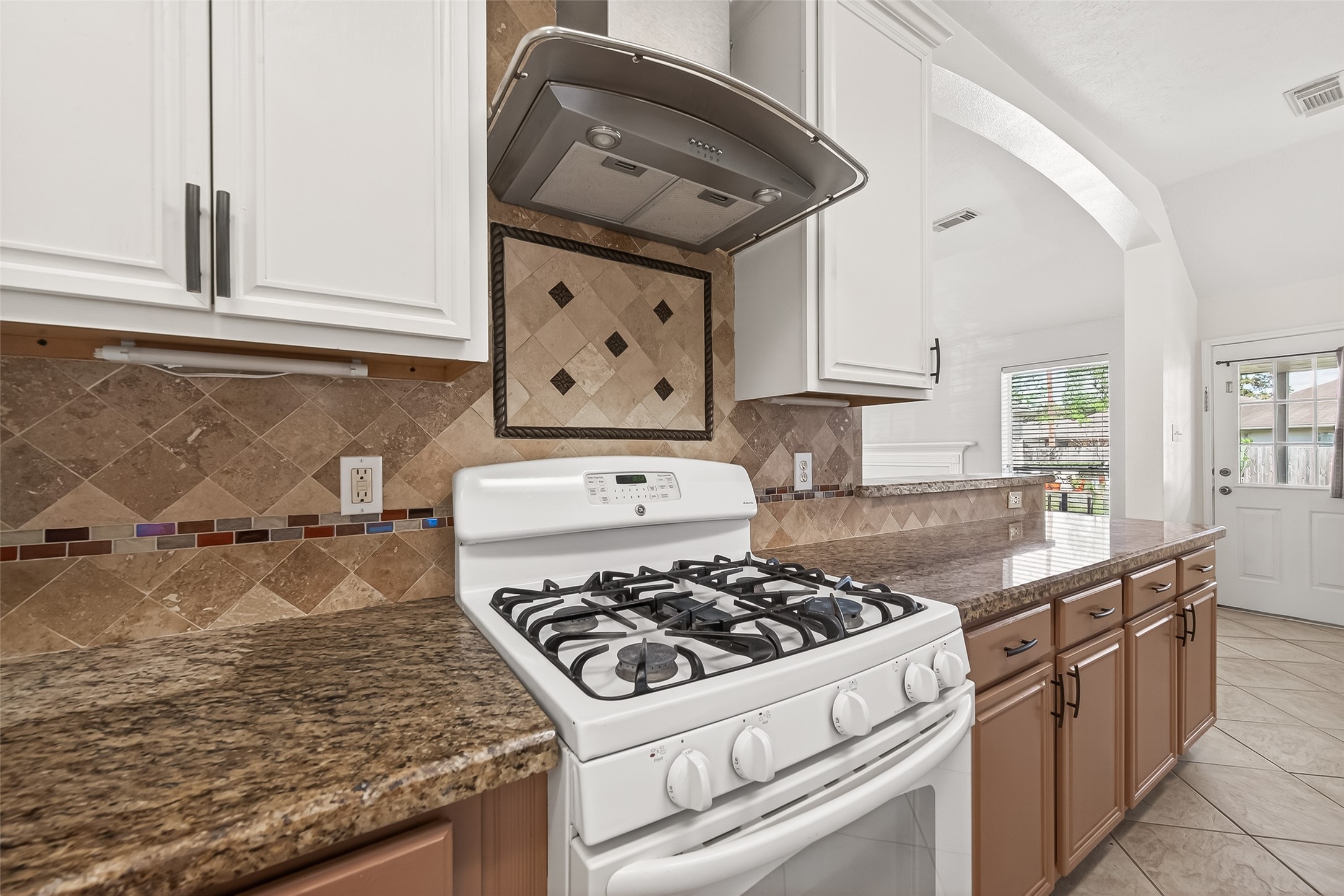 20839 Rivershire Lane Houston, TX 77073 - Photo 24 of 50 a white stove top oven sitting inside of a kitchen