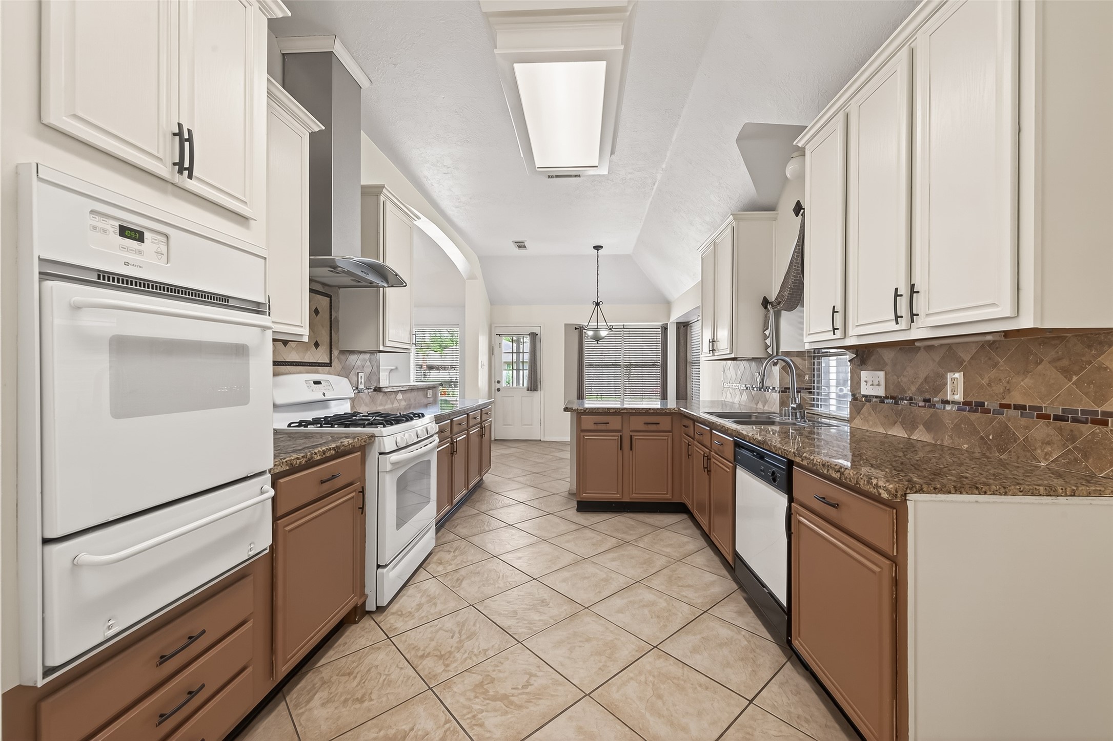 20839 Rivershire Lane Houston, TX 77073 - Photo 26 of 50 a kitchen with stainless steel appliances granite countertop a stove a sink and a refrigerator