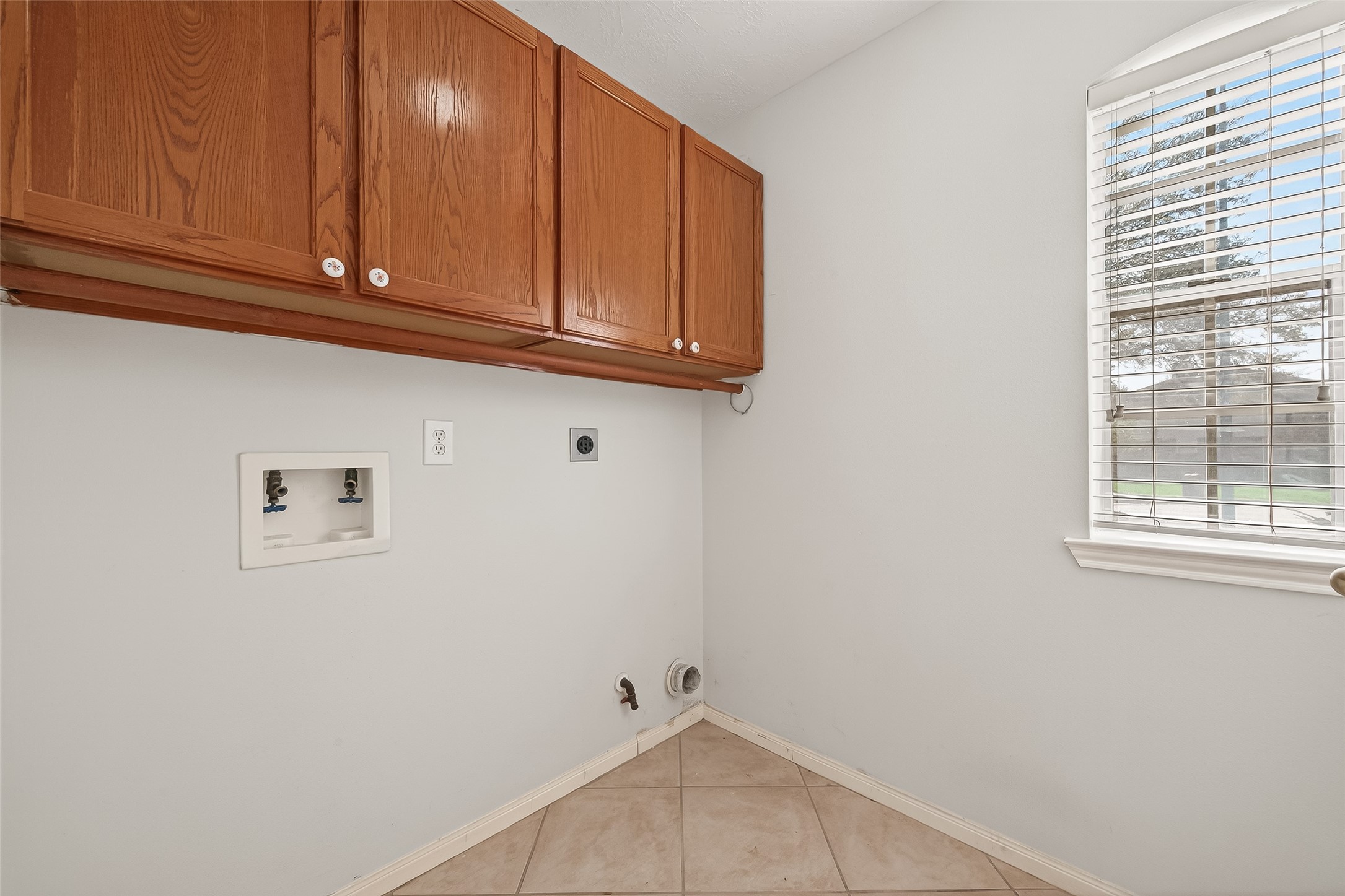 20839 Rivershire Lane Houston, TX 77073 - Photo 30 of 50 a view of storage and utility room with window