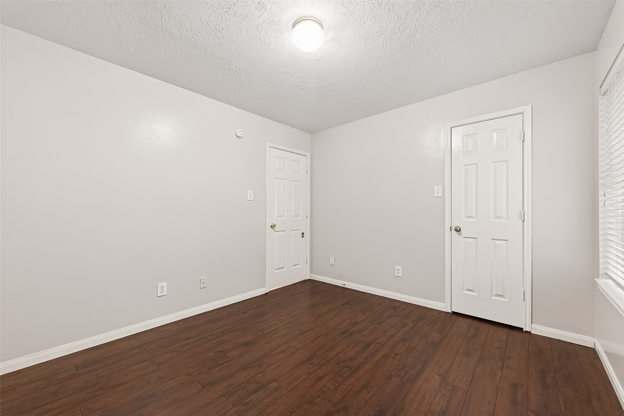 20839 Rivershire Lane Houston, TX 77073 - Photo 32 of 50 a view of an empty room with wooden floor