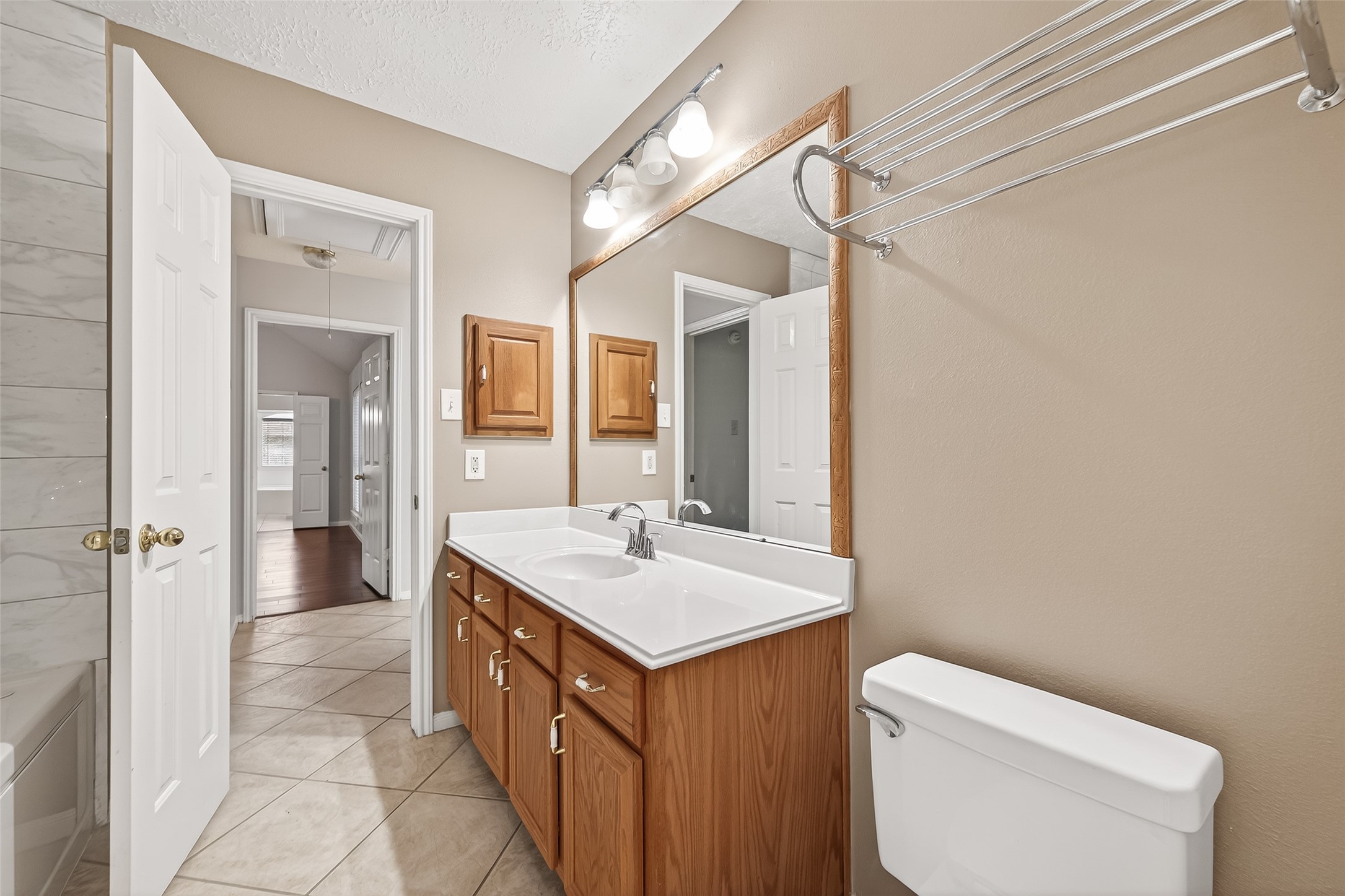 20839 Rivershire Lane Houston, TX 77073 - Photo 33 of 50 a bathroom with a sink a toilet and shower