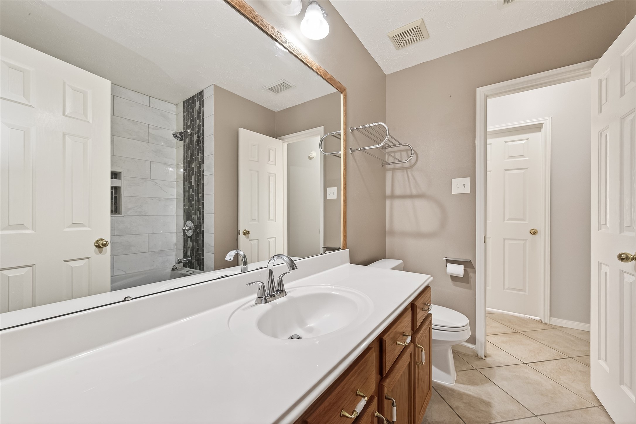 20839 Rivershire Lane Houston, TX 77073 - Photo 35 of 50 a bathroom with a sink and a mirror