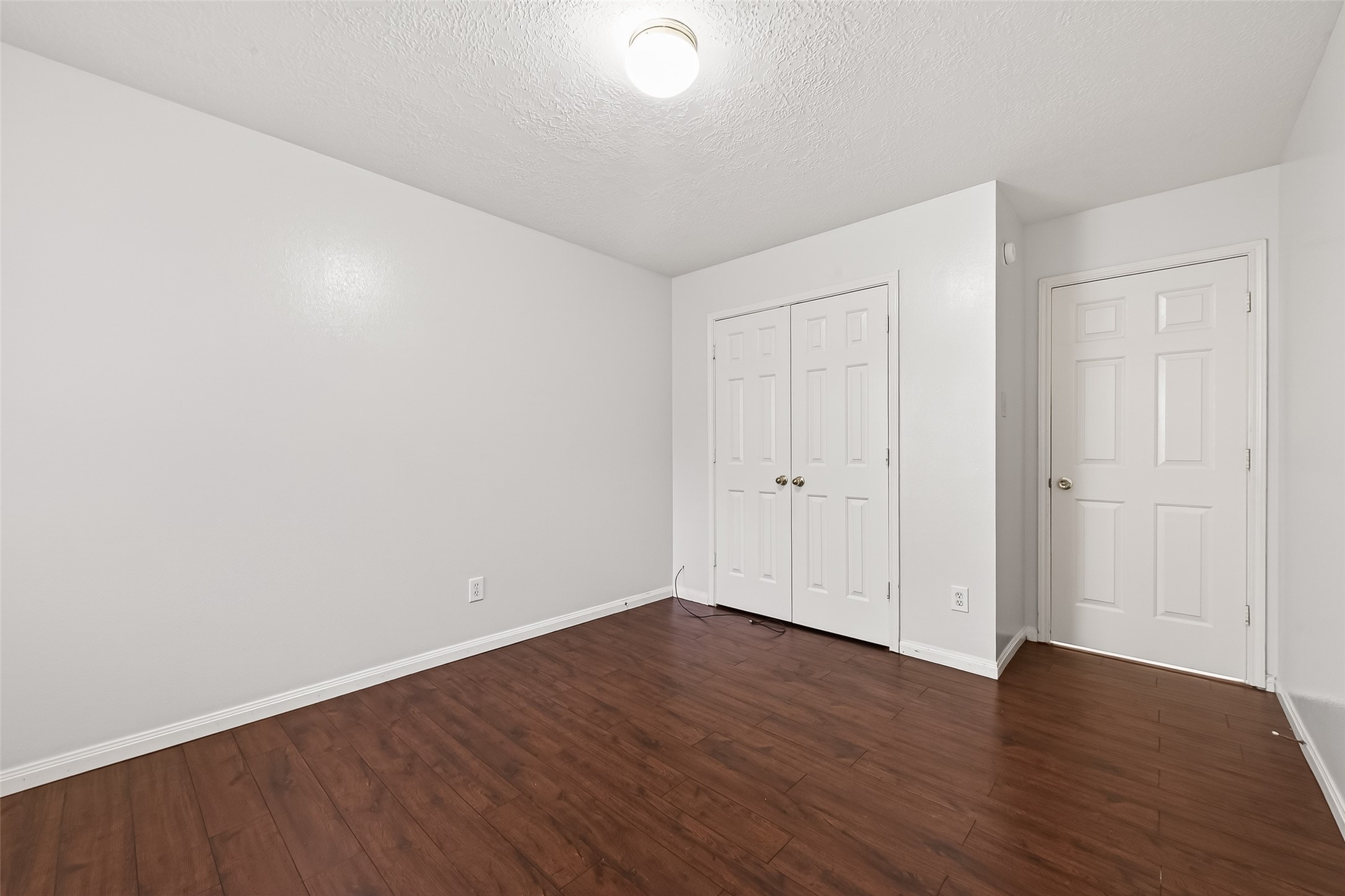 20839 Rivershire Lane Houston, TX 77073 - Photo 37 of 50 a view of an empty room with wooden floor