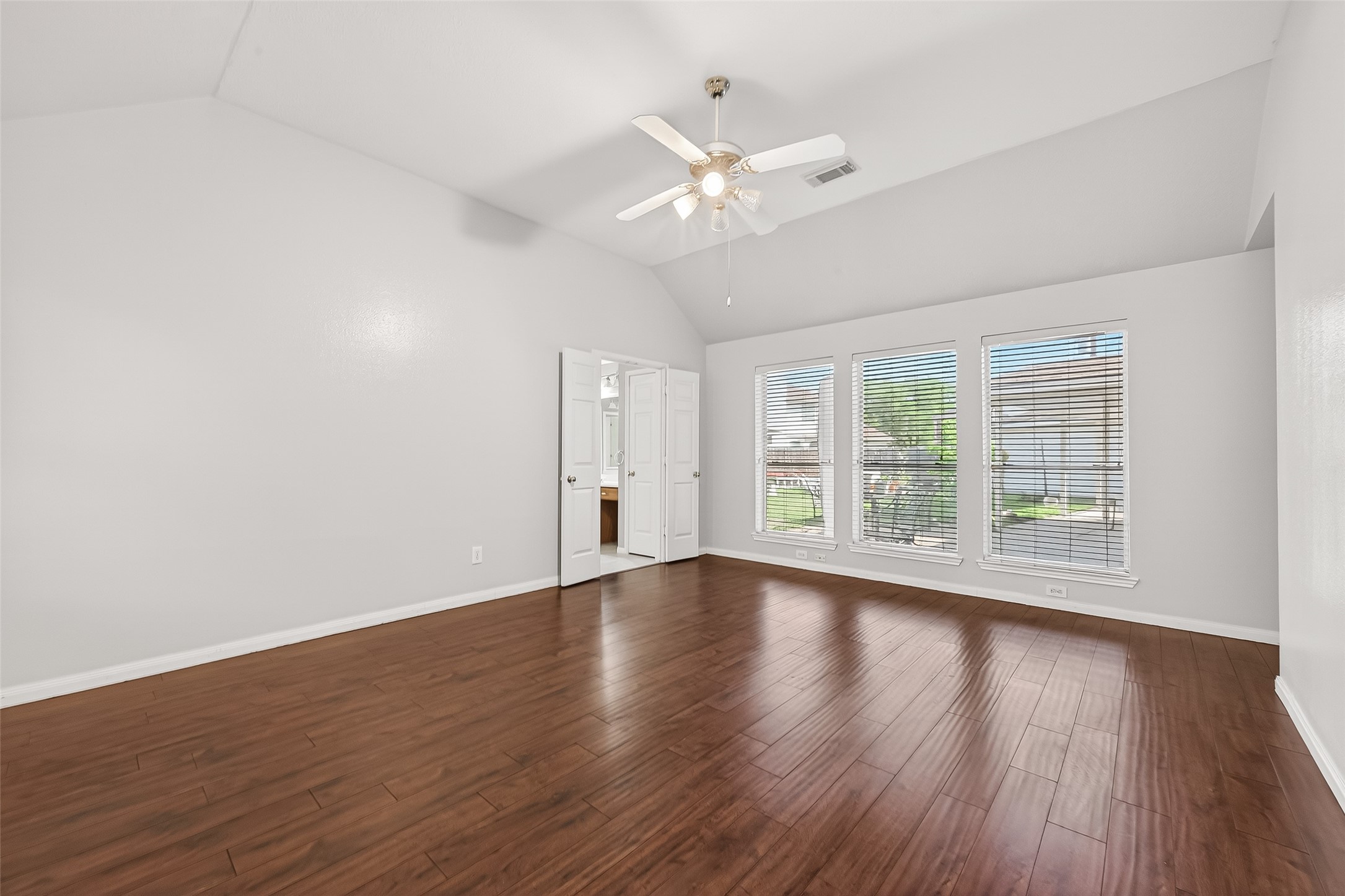 20839 Rivershire Lane Houston, TX 77073 - Photo 39 of 50 a view of an empty room with wooden floor and a window
