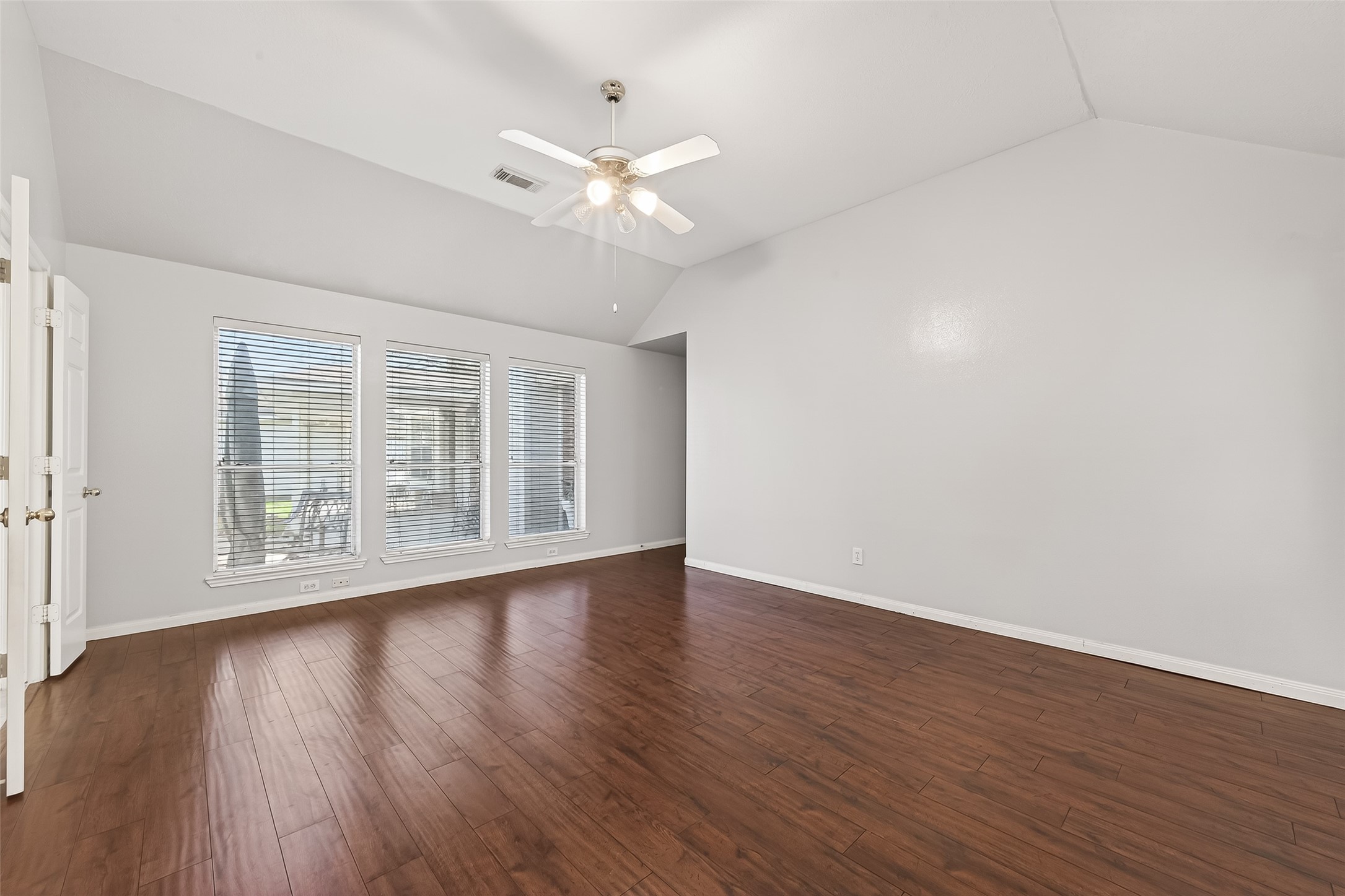 20839 Rivershire Lane Houston, TX 77073 - Photo 40 of 50 a view of an empty room with wooden floor and a window