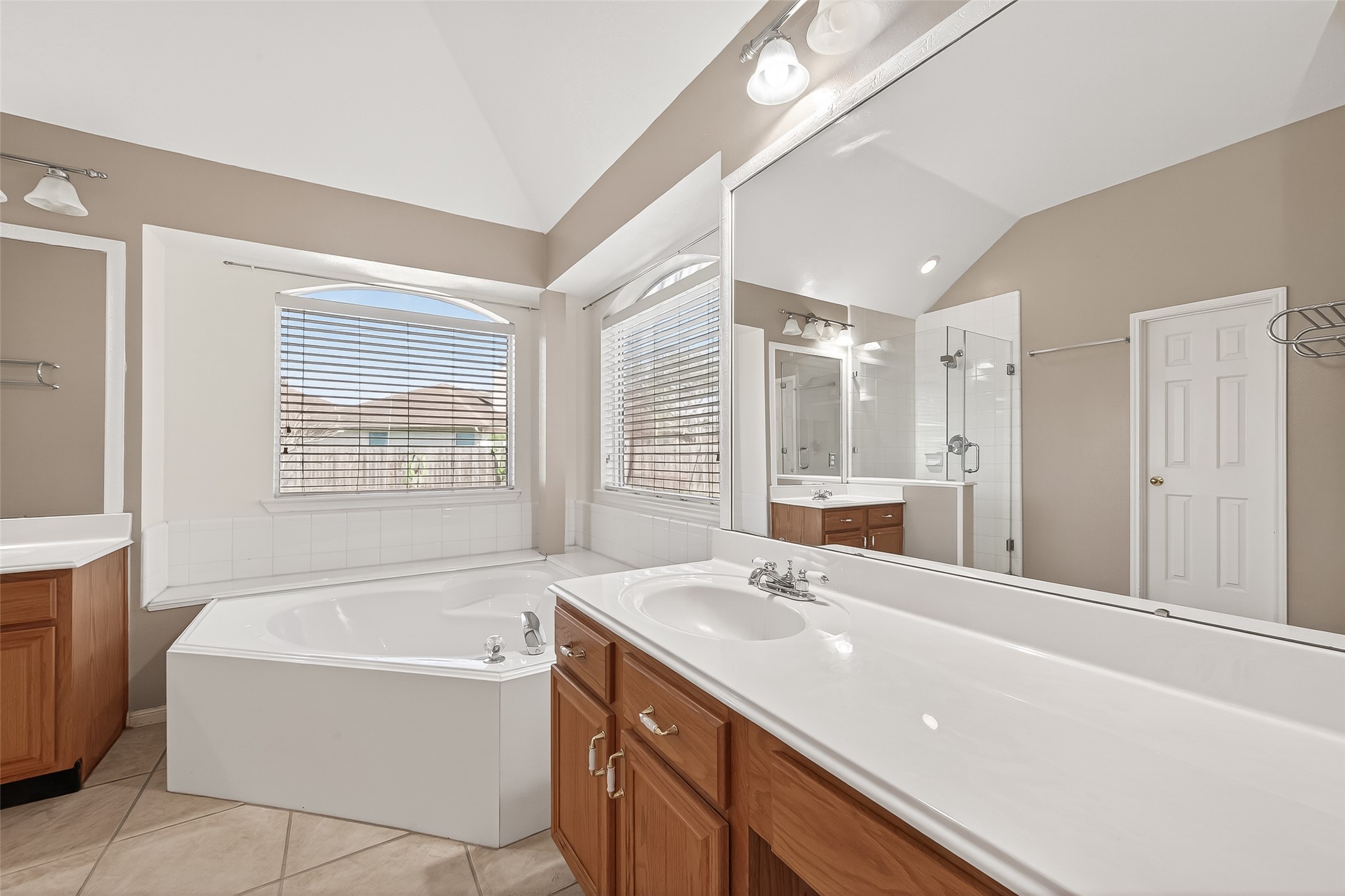 20839 Rivershire Lane Houston, TX 77073 - Photo 42 of 50 a bathroom with a tub sink and mirror