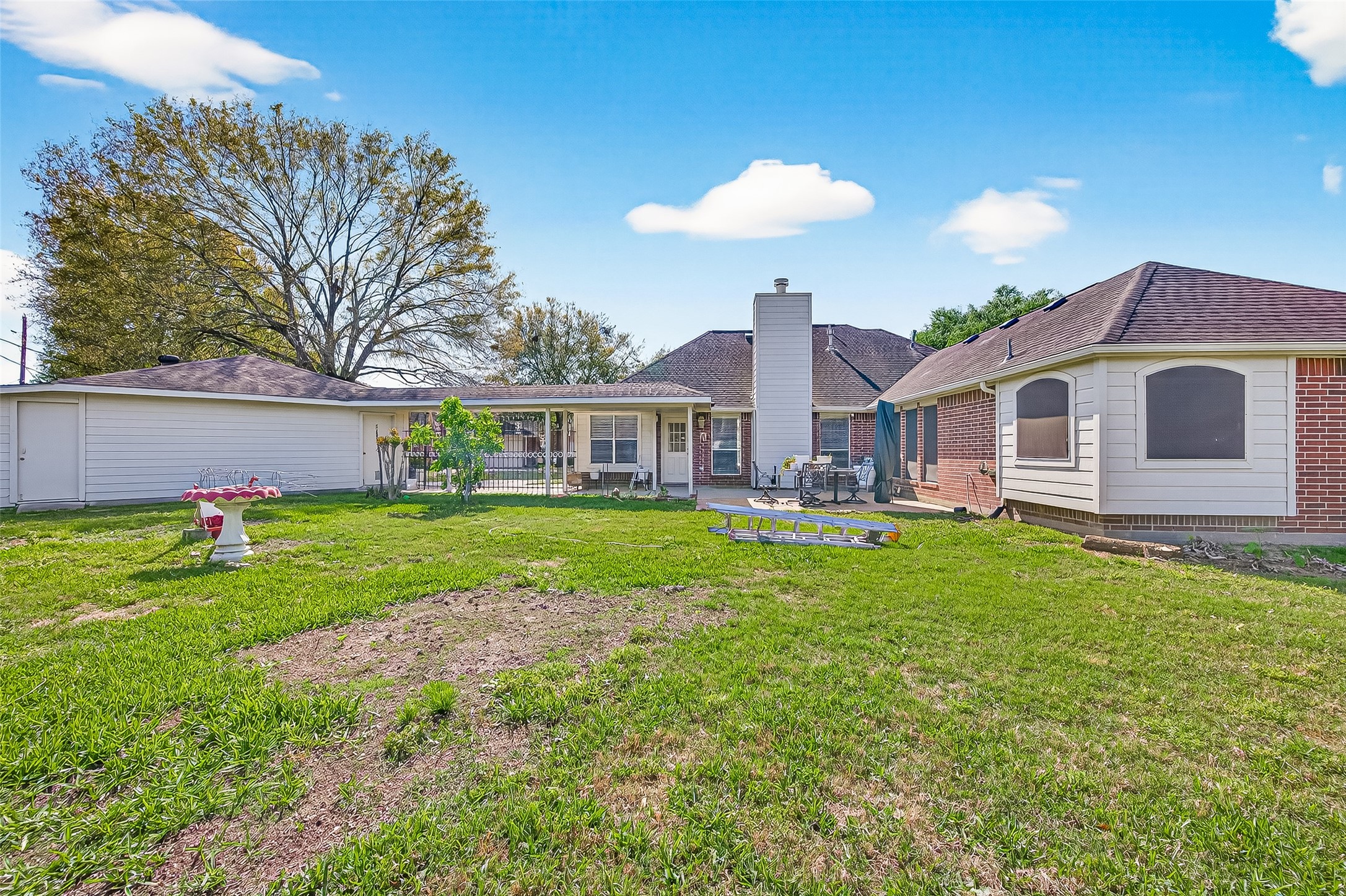 20839 Rivershire Lane Houston, TX 77073 - Photo 46 of 50 a front view of house with yard and swimming pool