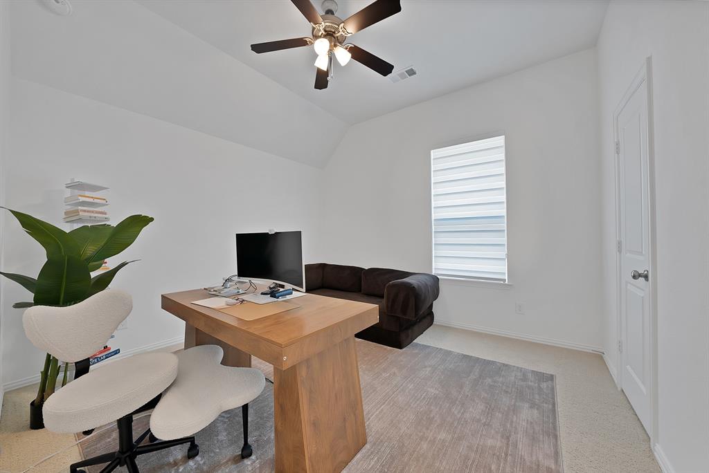 5012 Triadic Lane Prosper, TX 75078 - Photo 24 of 38 Room featuring a vaulted ceiling with a ceiling fan, a single window with blinds, and light-toned wall-to-wall carpeting