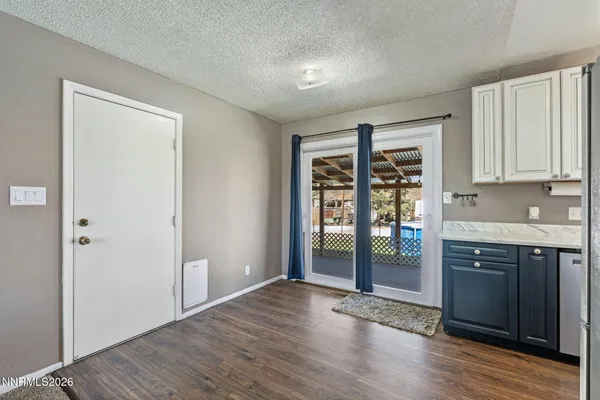 a view of kitchen with granite countertop window and a sink
