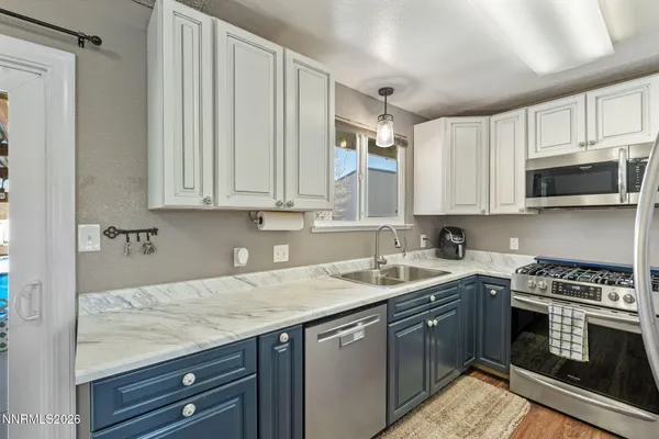a kitchen with a sink and a window