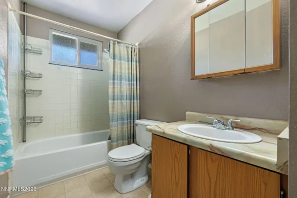 a front view of house with a garden