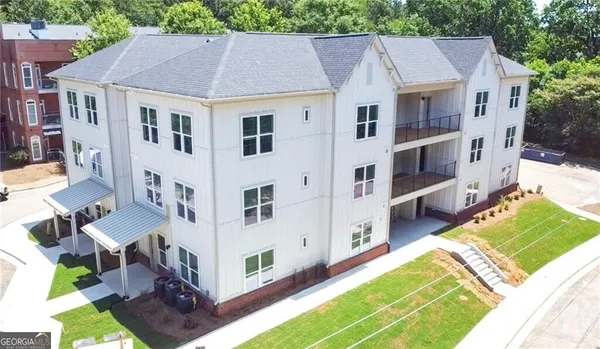 a aerial view of a house with a yard