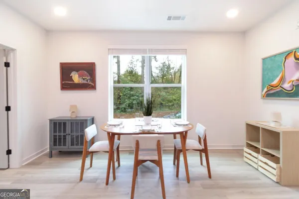 a workspace with furniture and a window