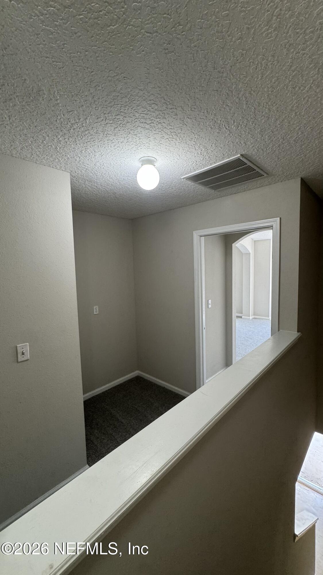 5260 Collins Road, Unit 1504 Jacksonville, FL 32244 - Photo 12 of 12 a view of a hallway