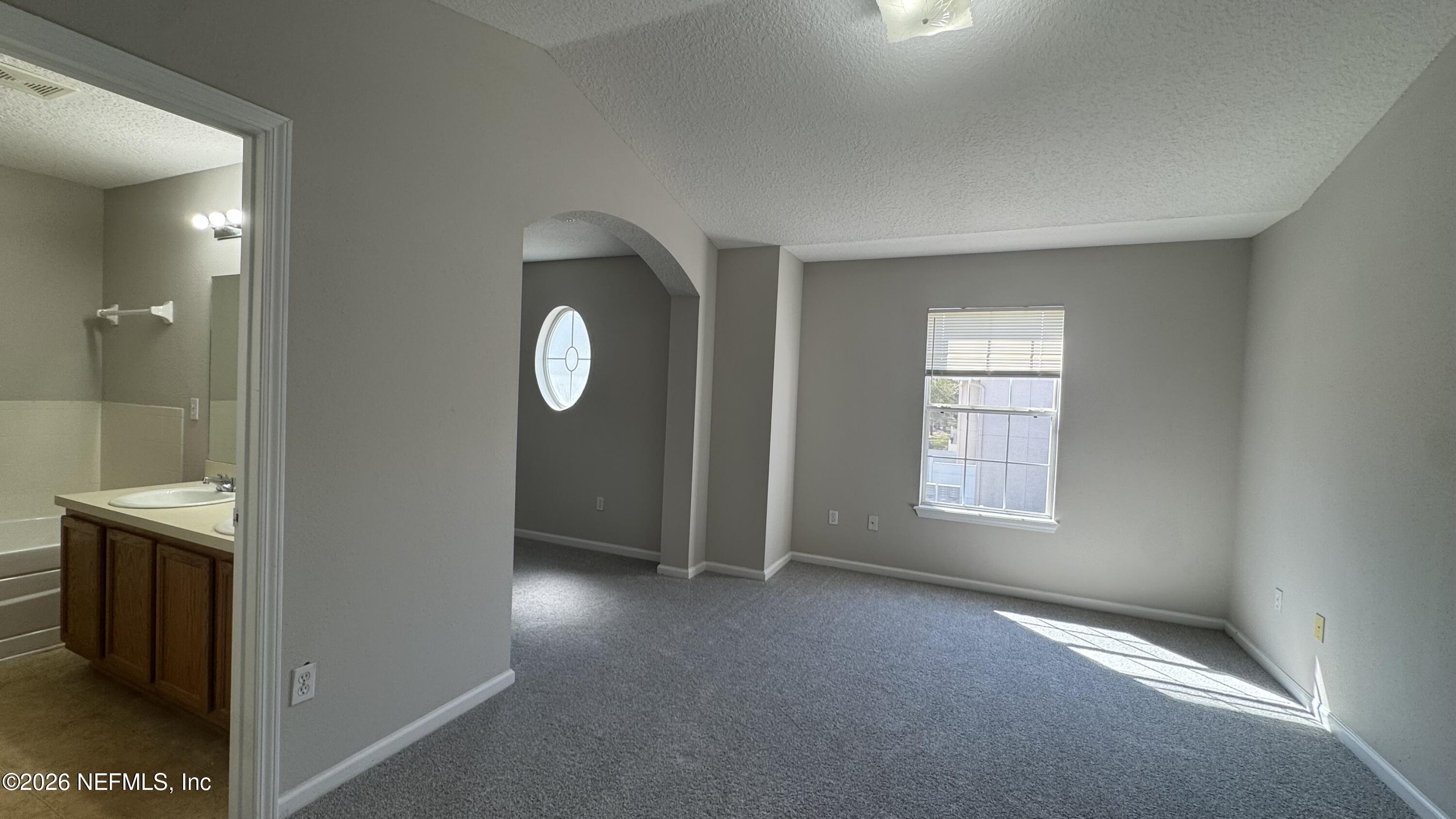5260 Collins Road, Unit 1504 Jacksonville, FL 32244 - Photo 8 of 12 a view of livingroom with hardwood floor and window