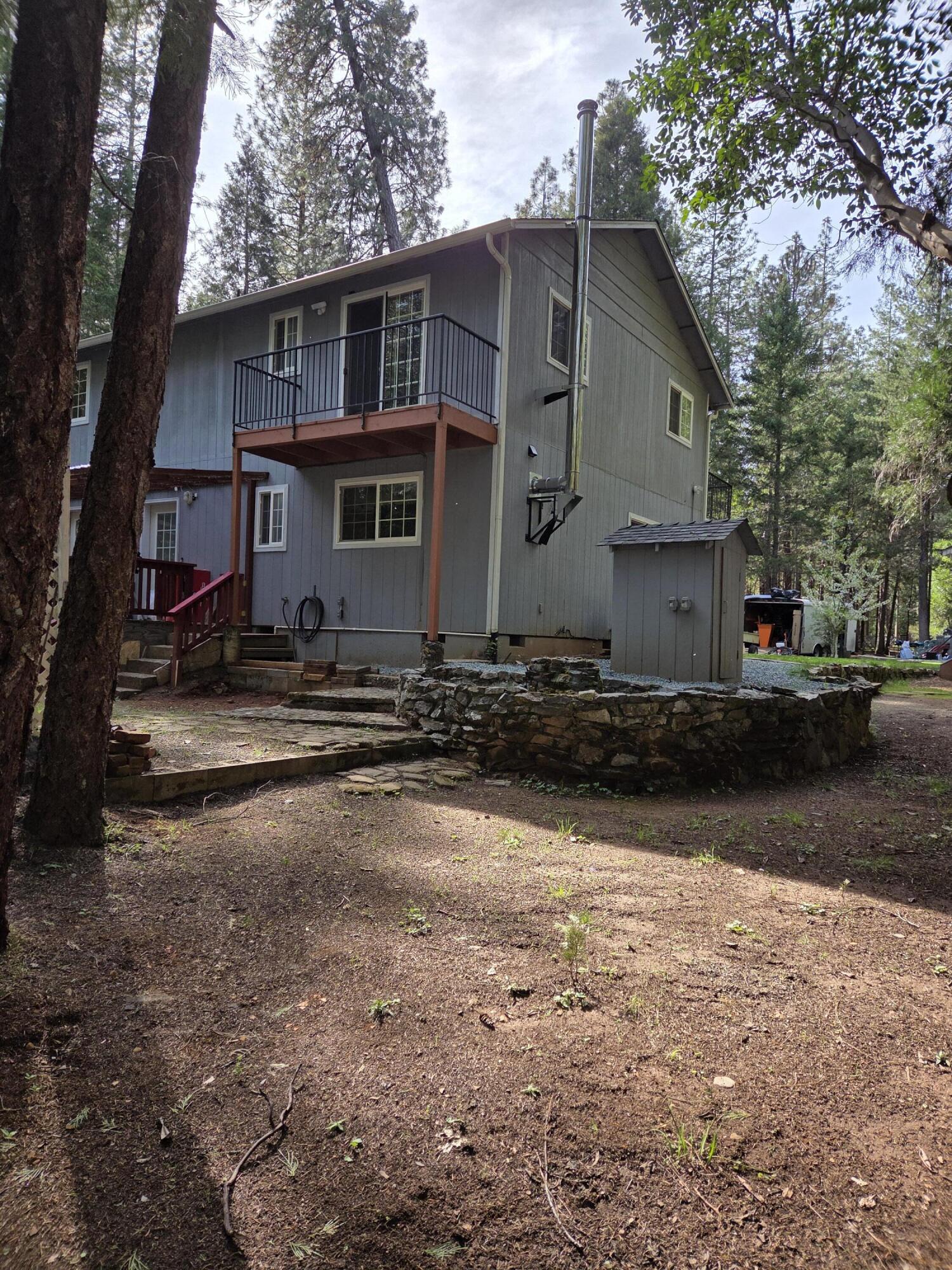 3760 Pleasant Creek Road Rogue River, OR 97537 - Photo 18 of 36 a view of a house with a yard
