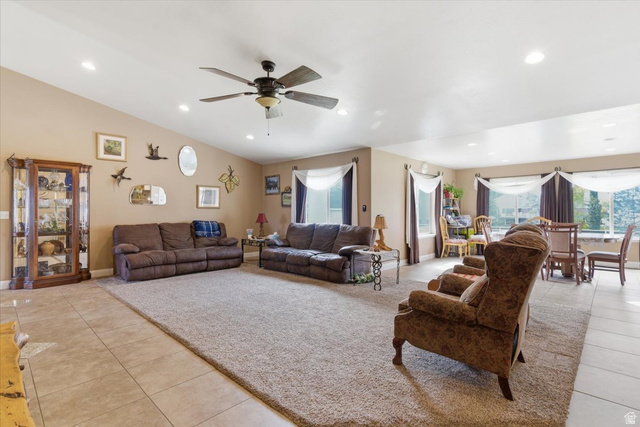 6237 West 4600th Street South Hooper, UT 84315 - Photo 8 of 48 Living room with light tile patterned floors, ceiling fan, recessed lighting, plenty of natural light, and vaulted ceiling
