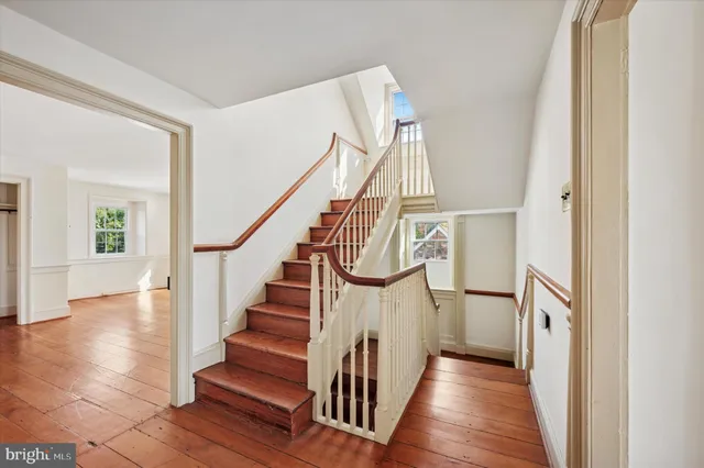 a view of entryway with wooden floor