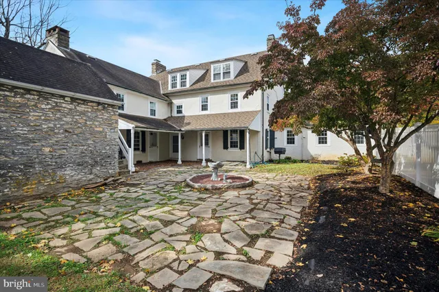 a front view of a house with yard
