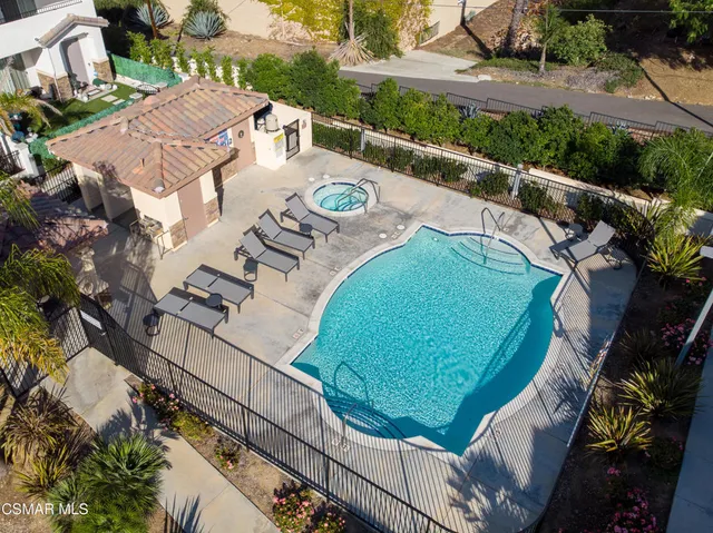 an aerial view of a house with outdoor space