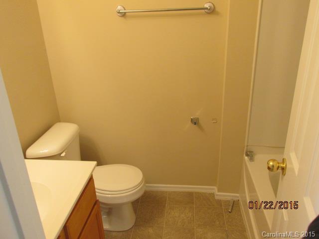 8808 Chalkstone Road Charlotte, NC 28216 - Photo 13 of 14 a white toilet sitting next to a shower