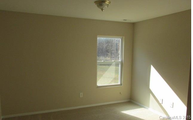 8808 Chalkstone Road Charlotte, NC 28216 - Photo 5 of 14 a view of an empty room and window