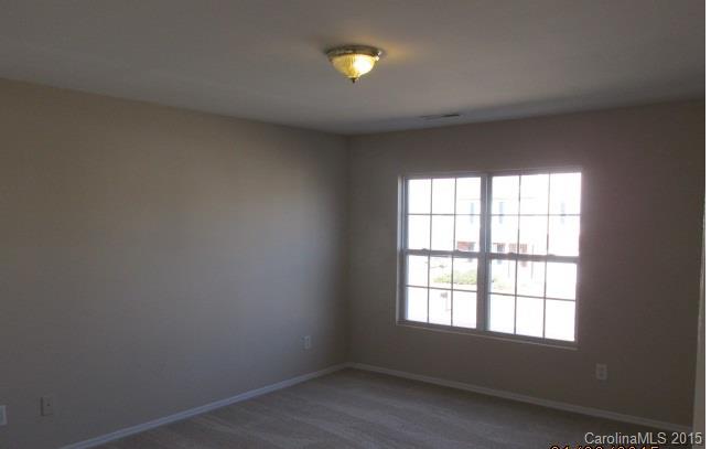 8808 Chalkstone Road Charlotte, NC 28216 - Photo 7 of 14 an empty room with a window