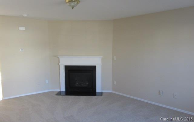 8808 Chalkstone Road Charlotte, NC 28216 - Photo 8 of 14 a room with a fireplace