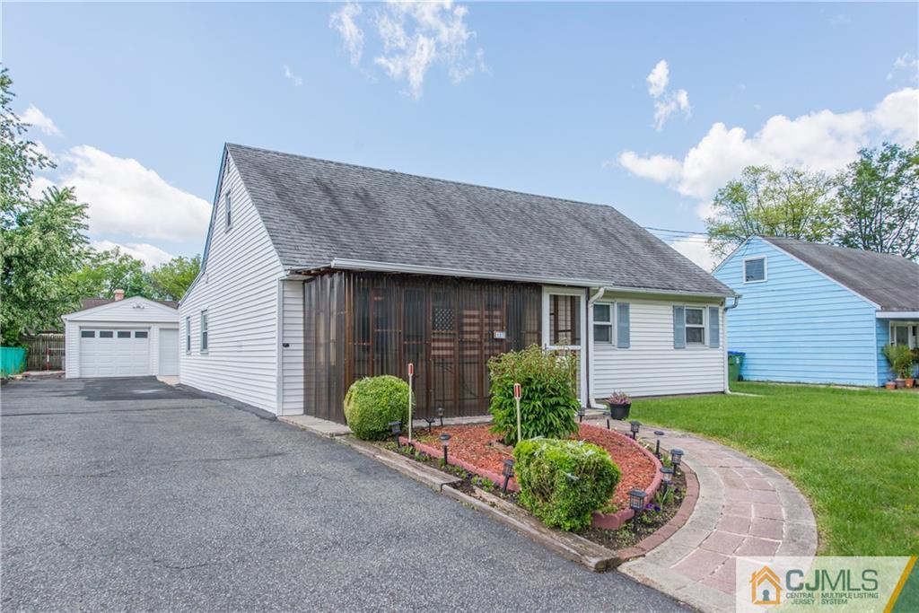 127 Idlewild Road Edison, NJ 08817 - Photo 1 of 21 a front view of a house with garden