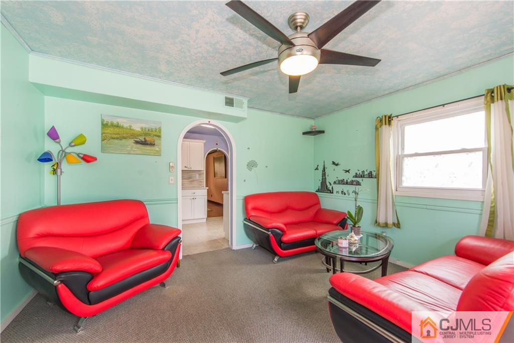 127 Idlewild Road Edison, NJ 08817 - Photo 11 of 21 a bedroom with furniture and a large window