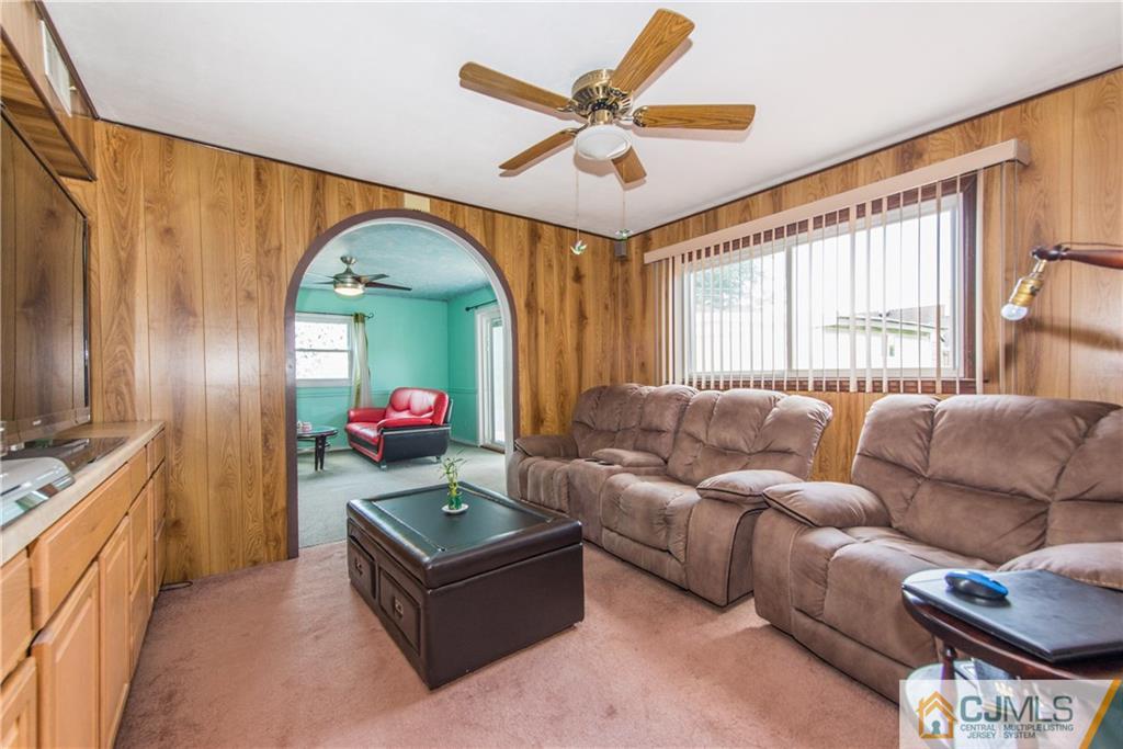 127 Idlewild Road Edison, NJ 08817 - Photo 12 of 21 a living room with furniture and a large window