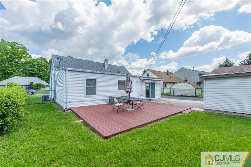 127 Idlewild Road Edison, NJ 08817 - Photo 20 of 21 a view of a house with a yard and sitting area