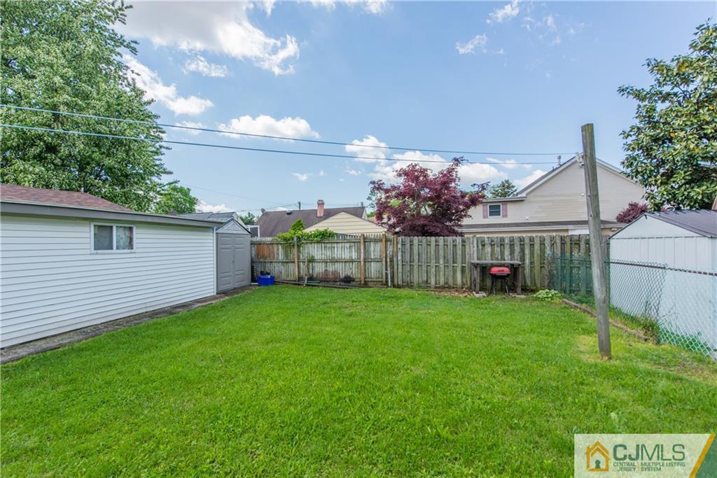 127 Idlewild Road Edison, NJ 08817 - Photo 21 of 21 a view of backyard with house and green space