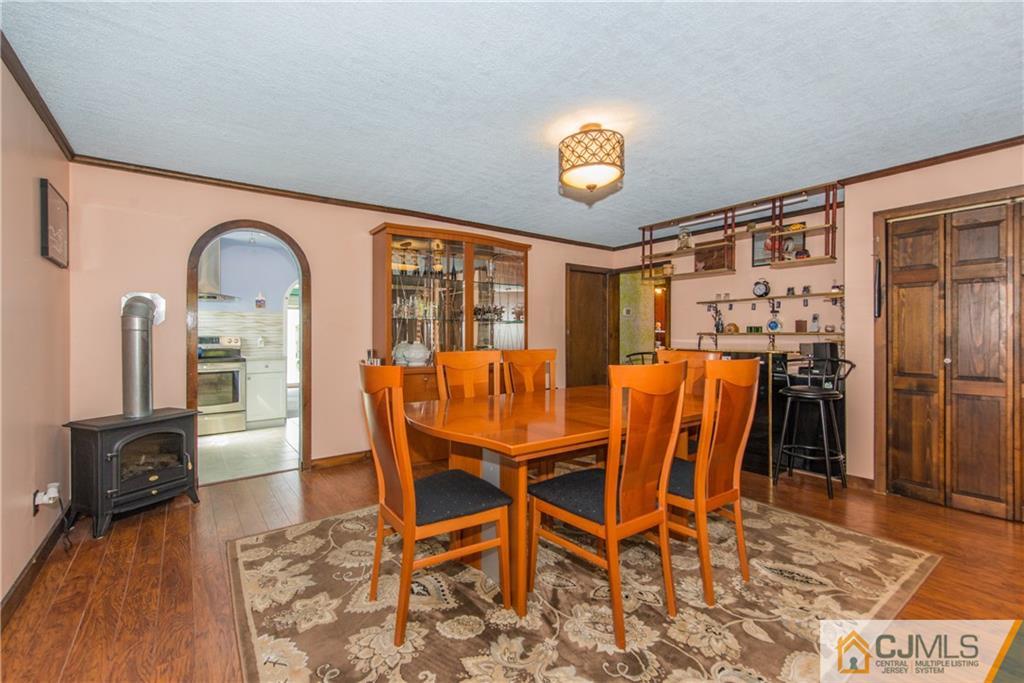 127 Idlewild Road Edison, NJ 08817 - Photo 5 of 21 a view of a dining room with furniture and wooden floor