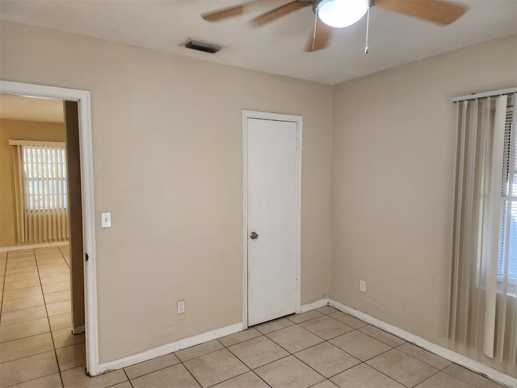 3904 West Walnut Street Tampa, FL 33607 - Photo 13 of 16 wooden floor in an empty room with a window