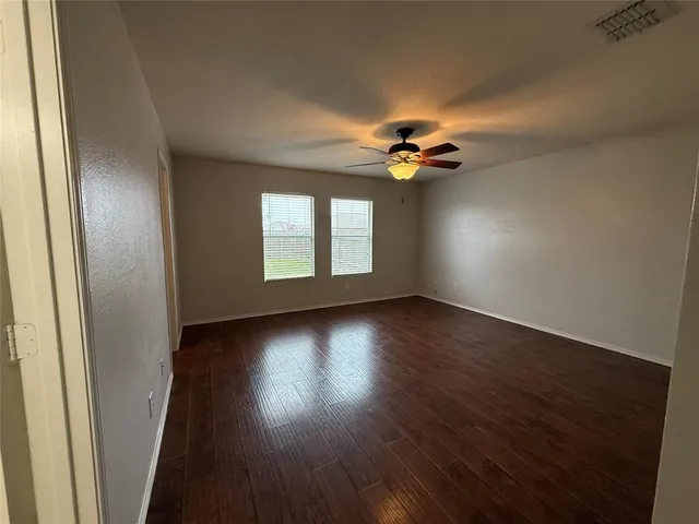 a bathroom with a shower and a bath tub