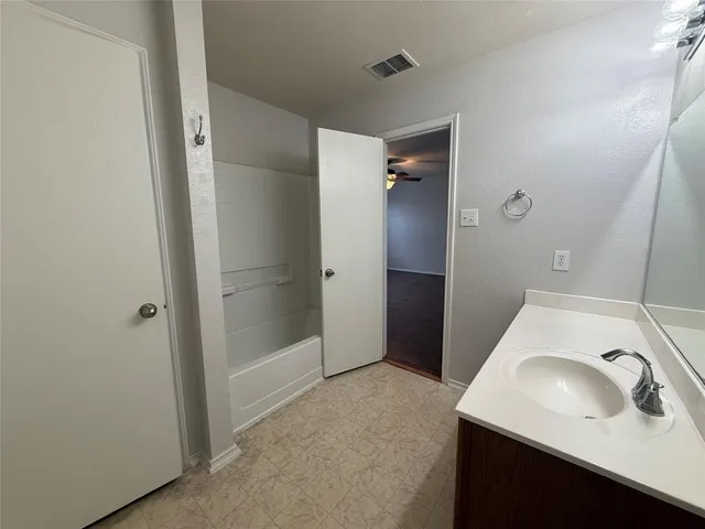 a bathroom with a sink and a tub