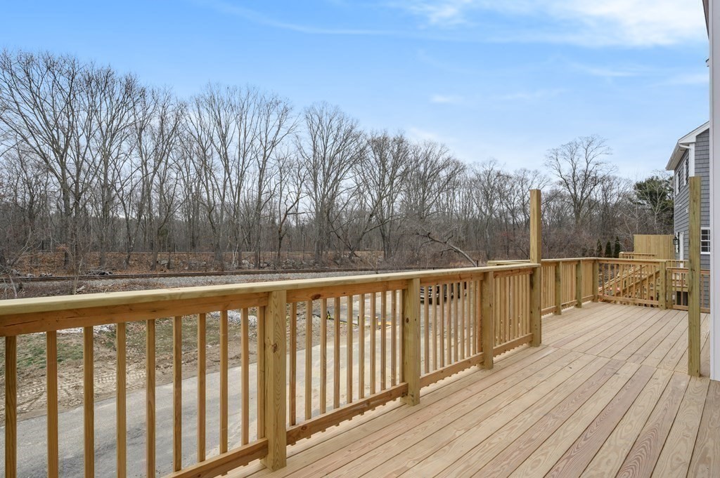 260 Main Street, Unit 3 Blackstone, MA 01504 - Photo 11 of 40 a view of balcony with wooden floor and fence