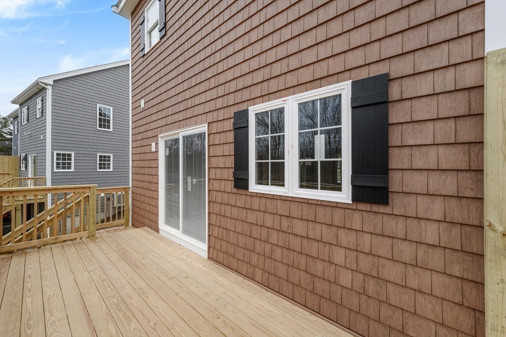 260 Main Street, Unit 3 Blackstone, MA 01504 - Photo 12 of 40 a view of a brick house with a large window