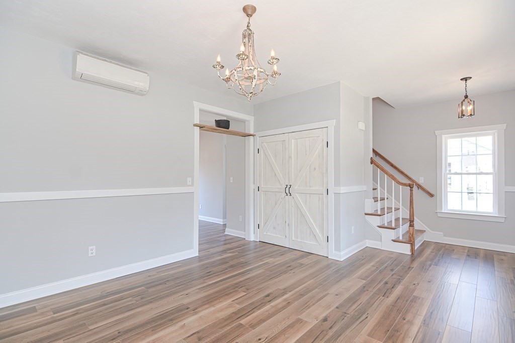 260 Main Street, Unit 3 Blackstone, MA 01504 - Photo 15 of 40 wooden floor in an empty room with a window
