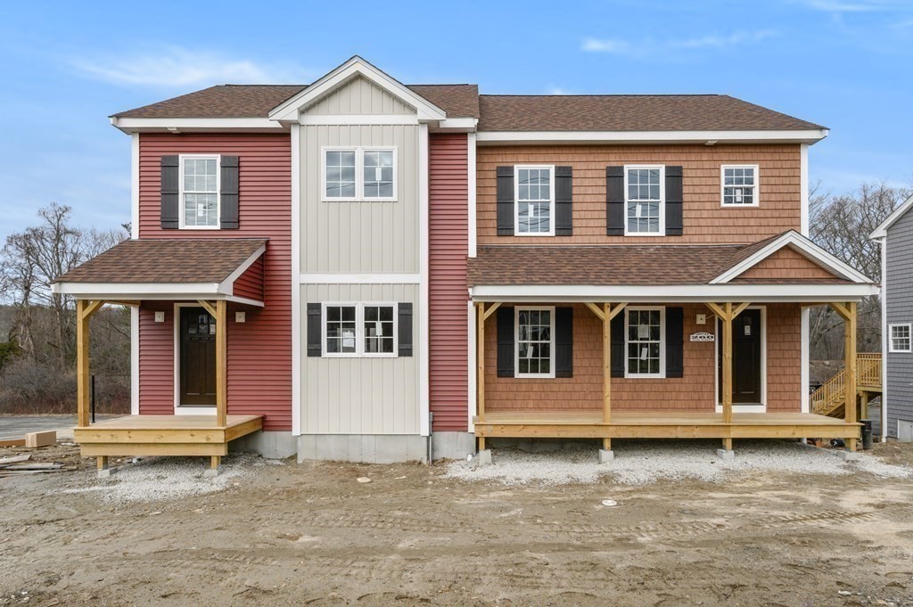 260 Main Street, Unit 3 Blackstone, MA 01504 - Photo 2 of 40 a view of a house with a yard and wooden fence
