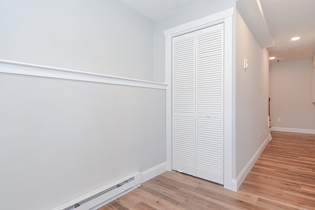 260 Main Street, Unit 3 Blackstone, MA 01504 - Photo 34 of 40 a view of an empty room with wooden floor