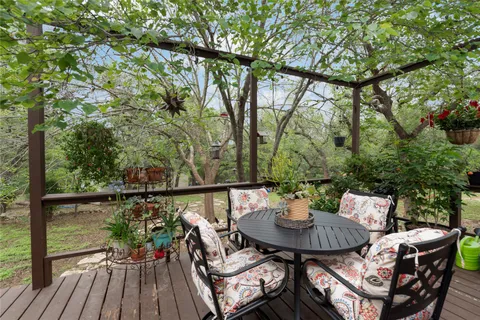 a view of a table and chairs in the patio
